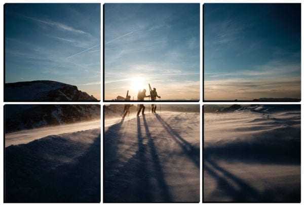 Skiers trek across the mountain top at sunset printed on 6 stylish PhotoSquares.