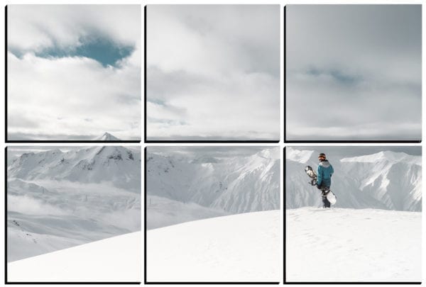 Snowboarder stands atop a snow covered mountain on 6 stylish PhotoSquares